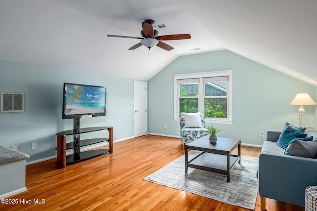 living area with vaulted ceiling, ceiling fan, visible vents, and light wood-style floors