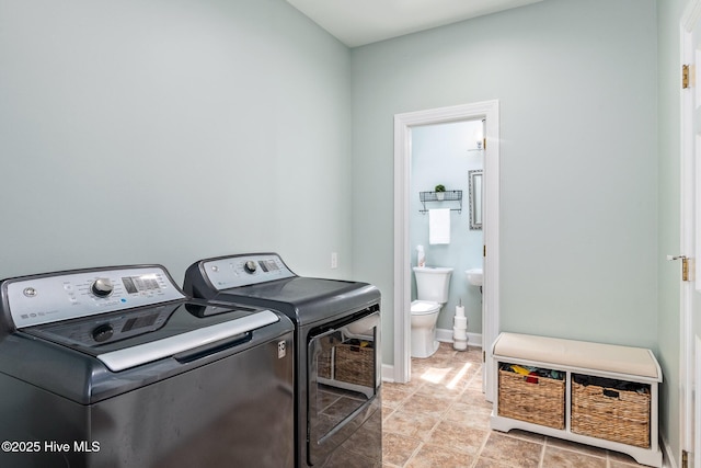 clothes washing area with laundry area and independent washer and dryer