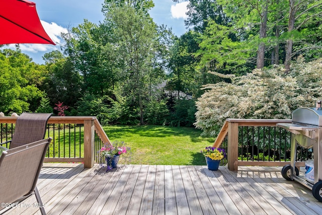 wooden deck with a lawn