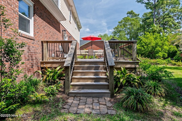 wooden deck featuring stairs