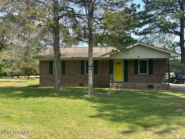 714 S Brown Rd, Enfield, NC 27823 - ranch-style home featuring brick siding, a front yard, crawl space, and covered porch