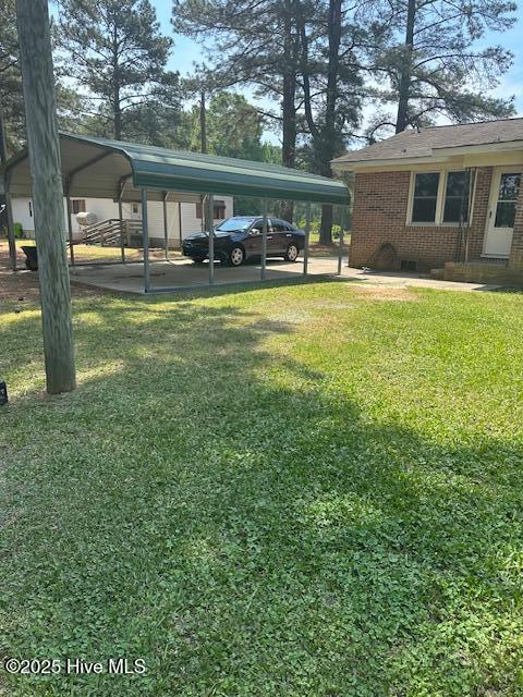 714 S Brown Rd, Enfield, NC 27823 - view of yard featuring a carport