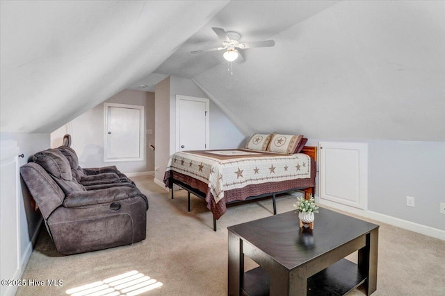 bedroom featuring baseboards, a ceiling fan, lofted ceiling, and light colored carpet