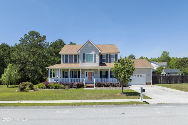 108 Nellie Ln, Swansboro, NC 28584 - colonial house featuring a porch, a front yard, fence, concrete driveway, and an attached garage