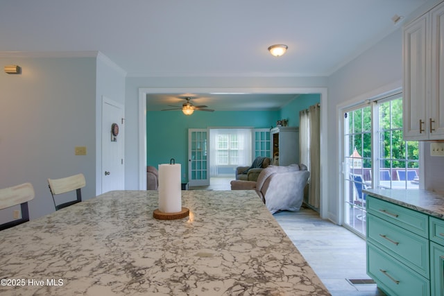 108 Nellie Ln, Swansboro, NC 28584 - dining space featuring crown molding, ceiling fan, and light wood-style floors