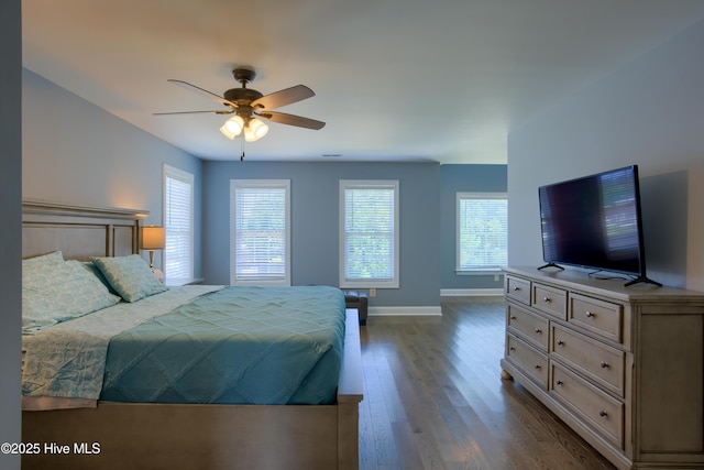 108 Nellie Ln, Swansboro, NC 28584 - bedroom featuring baseboards, ceiling fan, and dark wood-type flooring