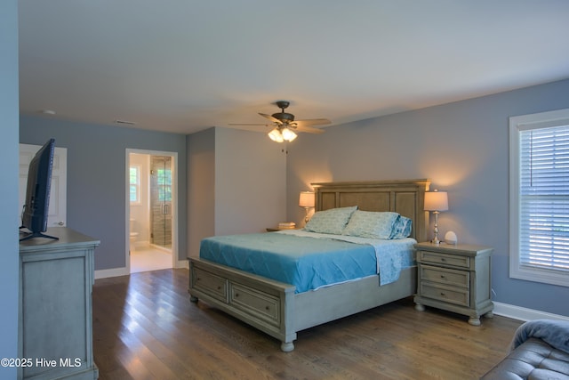 108 Nellie Ln, Swansboro, NC 28584 - bedroom featuring ceiling fan, dark wood-style flooring, visible vents, baseboards, and ensuite bathroom