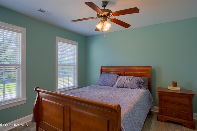 108 Nellie Ln, Swansboro, NC 28584 - bedroom featuring multiple windows, light wood-type flooring, and visible vents