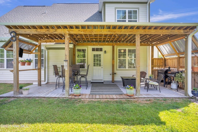167 Fallbrook Ln, Rocky Point, NC 28457 - rear view of house featuring a lawn, a wooden deck, and a patio area
