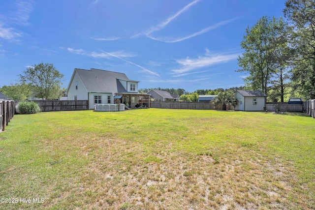 167 Fallbrook Ln, Rocky Point, NC 28457 - view of yard with a fenced backyard, a shed, and an outbuilding