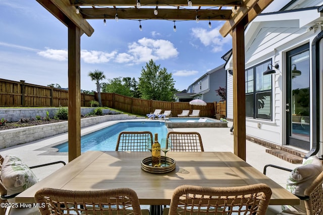 view of pool featuring a fenced backyard, a patio, a fenced in pool, and outdoor dining space