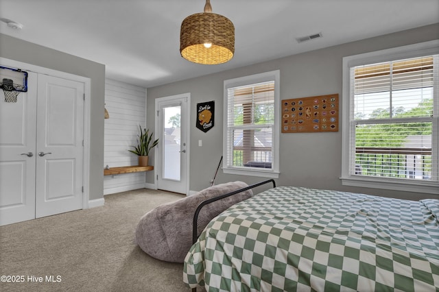 bedroom featuring carpet flooring, baseboards, a closet, and visible vents