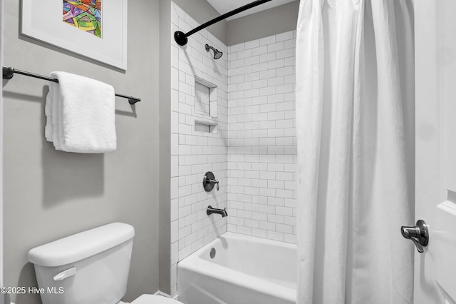 full bathroom featuring toilet and shower / bathtub combination with curtain