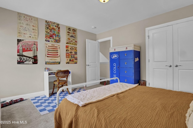 bedroom with carpet, baseboards, and a closet