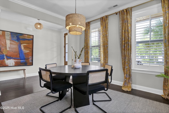dining room featuring baseboards, dark wood-style flooring, and visible vents