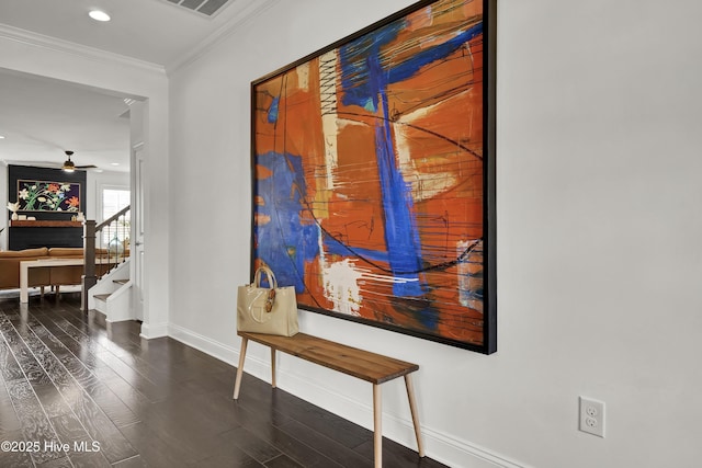 hallway featuring recessed lighting, baseboards, crown molding, wood finished floors, and stairway