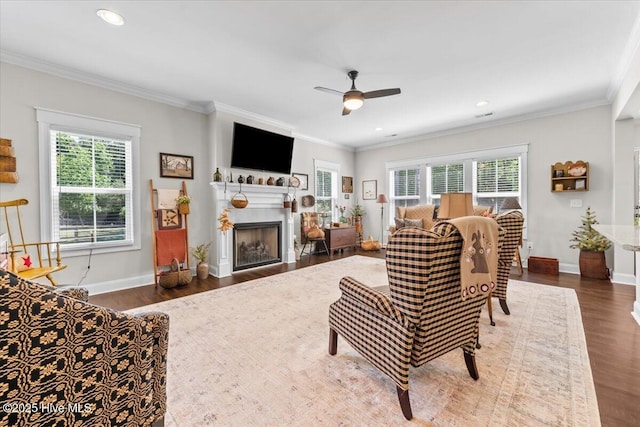 549 Abbey Rd, Carthage, NC 28327 - living room featuring wood finished floors, a ceiling fan, plenty of natural light, ornamental molding, and baseboards