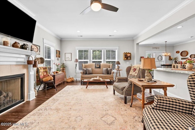 549 Abbey Rd, Carthage, NC 28327 - living area with wood finished floors, a fireplace, recessed lighting, a ceiling fan, and ornamental molding