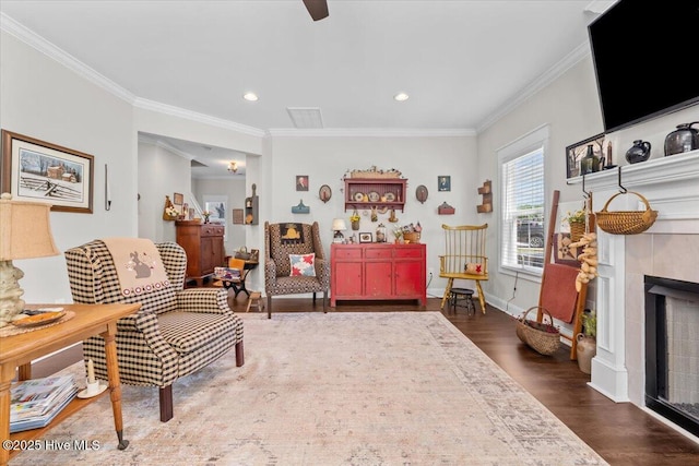 549 Abbey Rd, Carthage, NC 28327 - living area featuring dark wood-type flooring, crown molding, a tiled fireplace, recessed lighting, and a ceiling fan