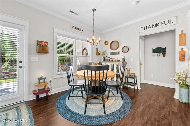 549 Abbey Rd, Carthage, NC 28327 - dining space featuring a chandelier, dark wood-type flooring, ornamental molding, and baseboards
