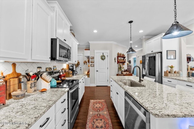 549 Abbey Rd, Carthage, NC 28327 - kitchen with appliances with stainless steel finishes, a sink, a center island with sink, ornamental molding, and white cabinets