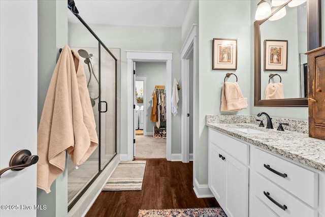 549 Abbey Rd, Carthage, NC 28327 - full bath with vanity, a shower stall, wood finished floors, and baseboards