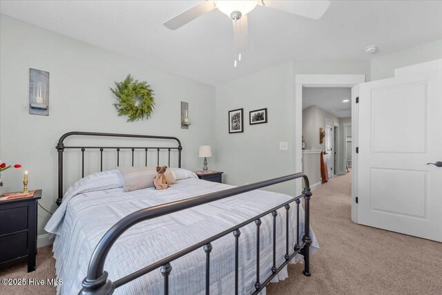 549 Abbey Rd, Carthage, NC 28327 - bedroom featuring light carpet, baseboards, and a ceiling fan