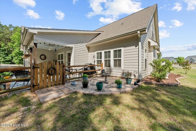 549 Abbey Rd, Carthage, NC 28327 - back of house with a yard, roof with shingles, and a patio