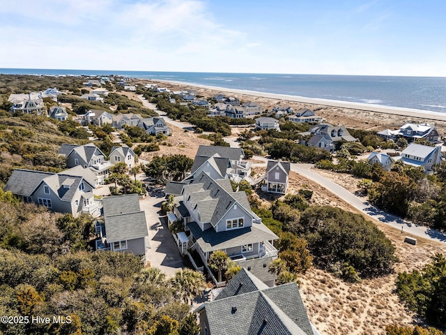 aerial view of residential area with expansive coastline