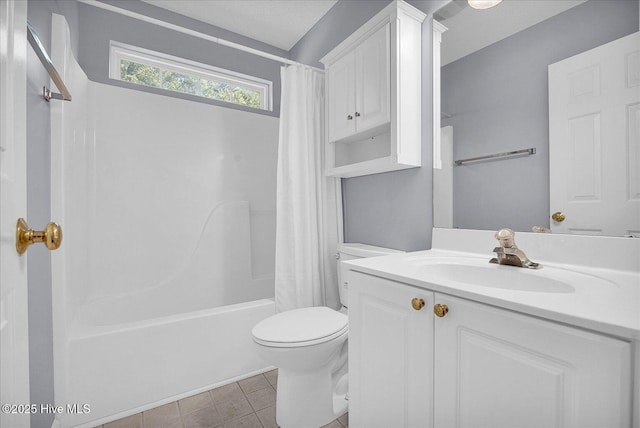 full bath with vanity, tile patterned floors, shower / bath combo, and toilet