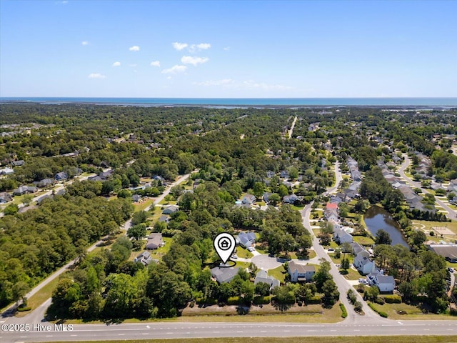 aerial view with a view of trees and a water view
