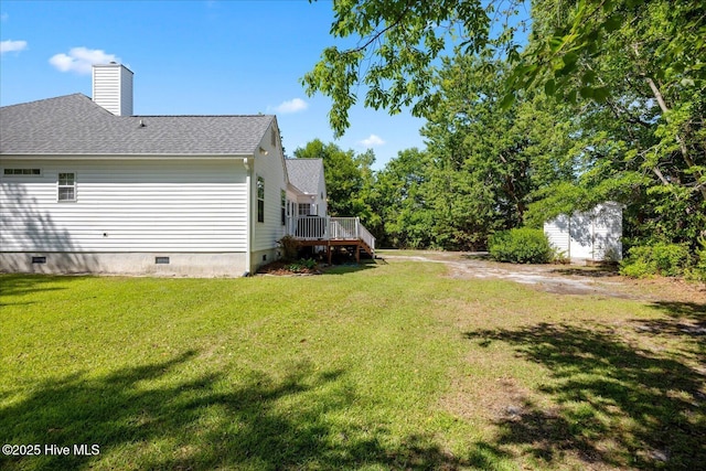 view of yard featuring a wooden deck and stairs