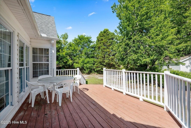 wooden deck with outdoor dining space