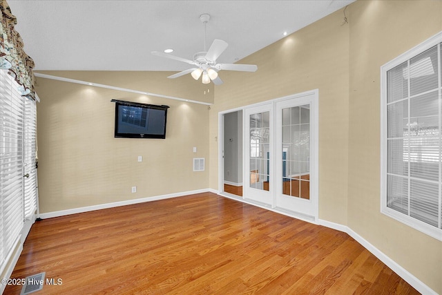 unfurnished room featuring light wood-type flooring, a ceiling fan, baseboards, and visible vents