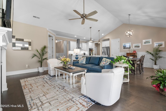 9036 Island Rider Ct NE, Leland, NC 28451 - living area featuring wainscoting, a ceiling fan, dark wood-style flooring, and visible vents
