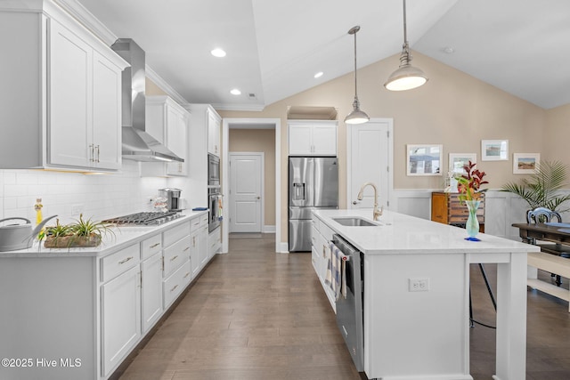 9036 Island Rider Ct NE, Leland, NC 28451 - kitchen with a sink, wall chimney exhaust hood, stainless steel appliances, decorative backsplash, and pendant lighting