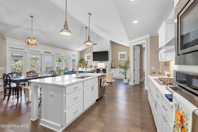 9036 Island Rider Ct NE, Leland, NC 28451 - kitchen with a sink, light countertops, ceiling fan, and appliances with stainless steel finishes