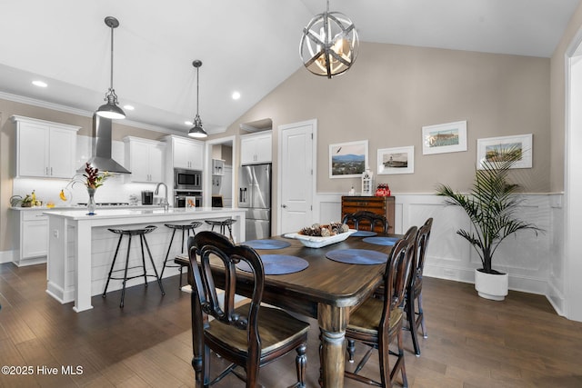 9036 Island Rider Ct NE, Leland, NC 28451 - dining area with a wainscoted wall, dark wood-style floors, lofted ceiling, ornamental molding, and recessed lighting
