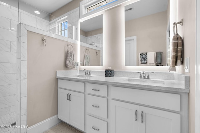 9036 Island Rider Ct NE, Leland, NC 28451 - bathroom with tiled shower, visible vents, and a sink