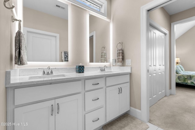 9036 Island Rider Ct NE, Leland, NC 28451 - full bath featuring a sink, connected bathroom, double vanity, and visible vents