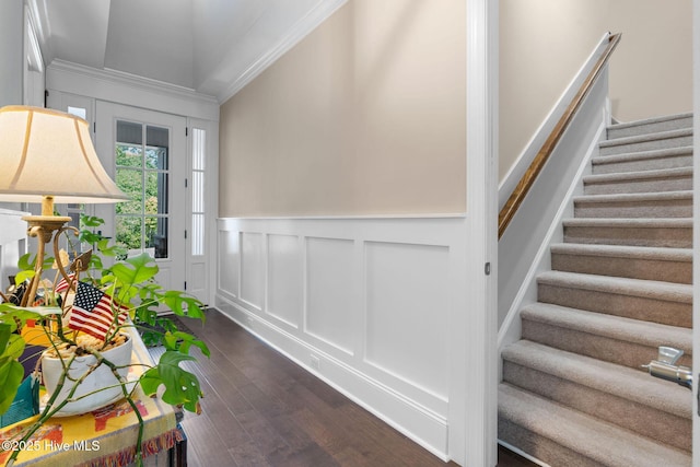 9036 Island Rider Ct NE, Leland, NC 28451 - interior space with crown molding, wainscoting, a decorative wall, dark wood-style floors, and stairway