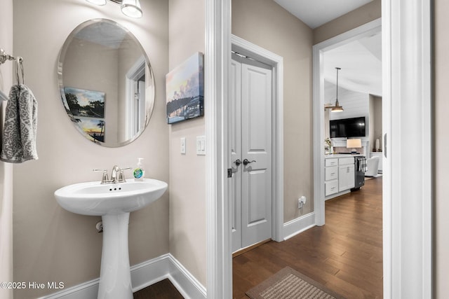 9036 Island Rider Ct NE, Leland, NC 28451 - bathroom featuring baseboards and wood finished floors