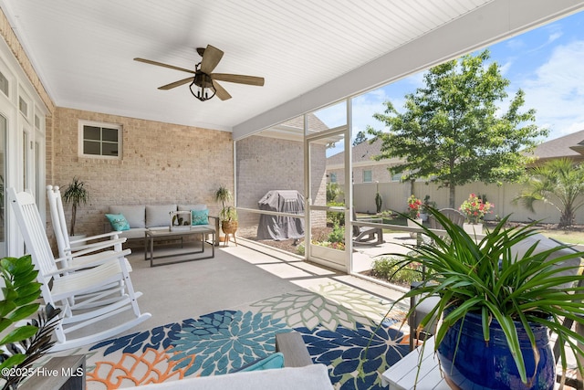 9036 Island Rider Ct NE, Leland, NC 28451 - sunroom / solarium featuring a ceiling fan and an outdoor hangout area