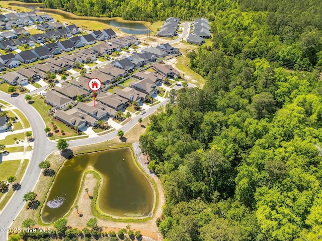 9036 Island Rider Ct NE, Leland, NC 28451 - drone / aerial view featuring a water view, a view of trees, and a residential view