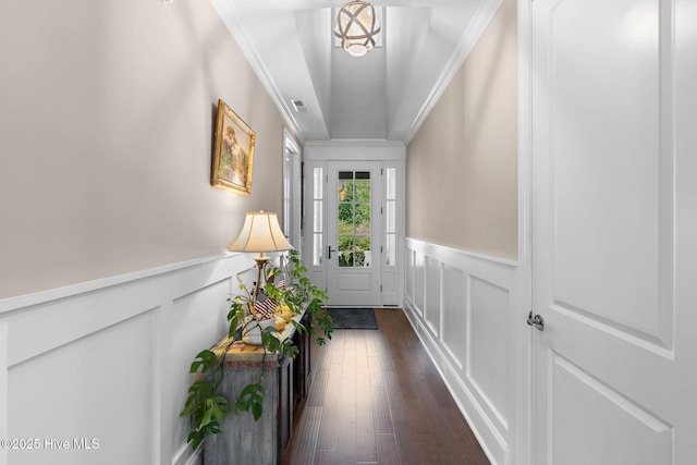 9036 Island Rider Ct NE, Leland, NC 28451 - doorway to outside featuring a decorative wall, dark wood-style floors, ornamental molding, and a wainscoted wall