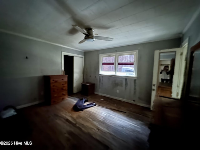 unfurnished bedroom with a closet, a ceiling fan, and wood finished floors
