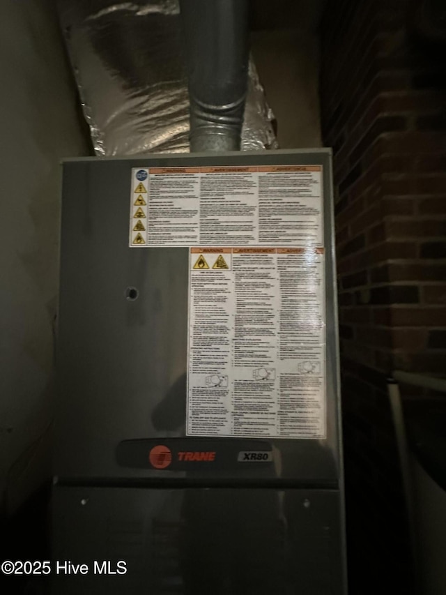 utility room with heating unit