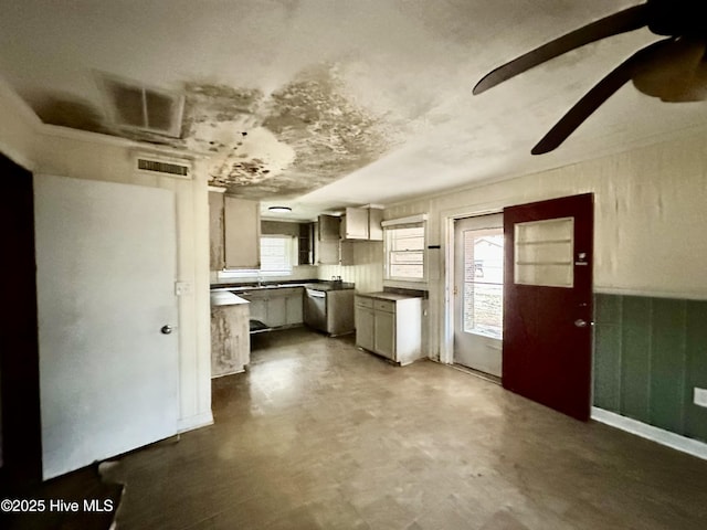 kitchen featuring concrete flooring, ceiling fan, and visible vents