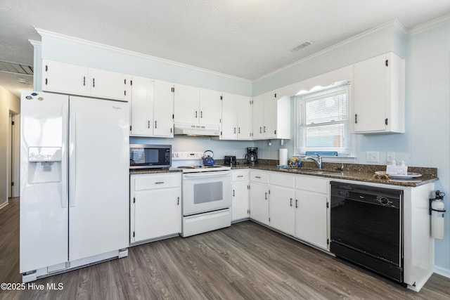 kitchen featuring dark wood-style flooring, a sink, white appliances, under cabinet range hood, and visible vents