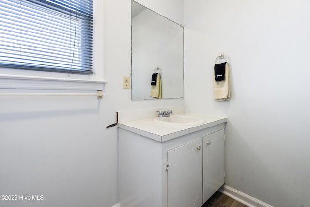 bathroom with baseboards and vanity